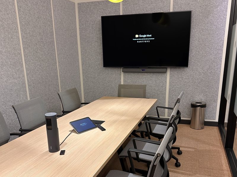 Meeting room with a large wall-mounted display and concealed cabling